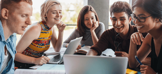 Happy people looking at laptop screen